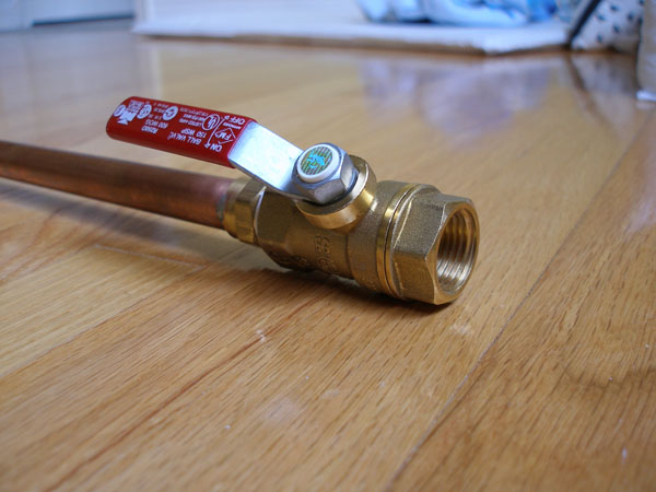 Ball valve attached to the long copper pipe, first view