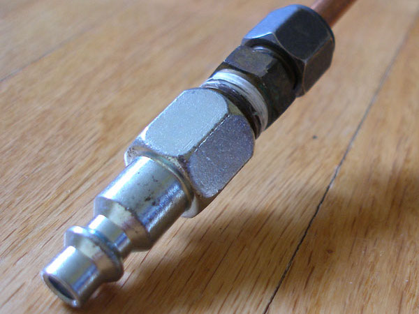 Compressed-air quick connector and compression fitting