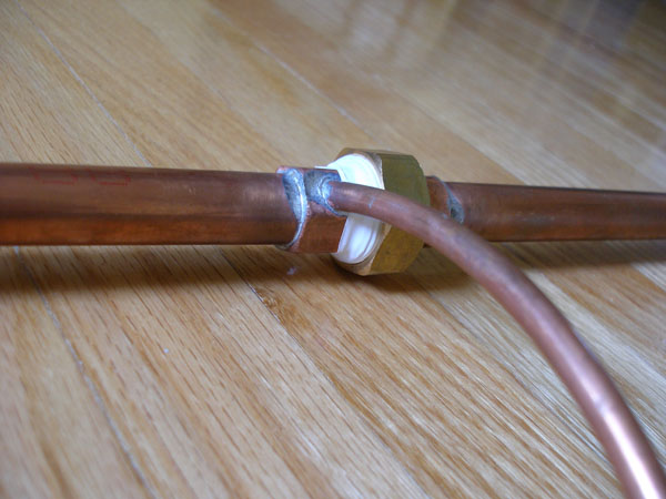 Assembled vortex chamber showing the angled small copper inlet tube